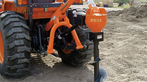 post hole digger skid steer attachment|kubota post hole digger attachment.